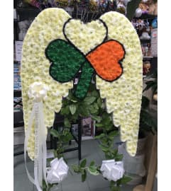 Angel Wings With Shamrock. An arrangement by Elegant Florist.