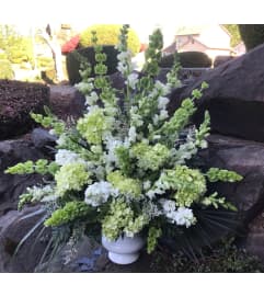 Green and White Arrangement for the Funeral. An arrangement by Renton Flower Shop.