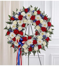 Standing Wreath- Red, White and Blue. An arrangement by Elegant Florist.