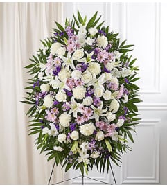 Standing Spray Lavender and White Sympathy. An arrangement by Elegant Florist.