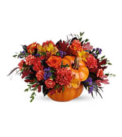 Teleflora Hauntingly Pretty Pumpkin Bouquet. An arrangement by Triple A Florist.