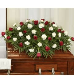 Kelly Ann’s red and white casket spray. An arrangement by Kelly Ann's Floral.