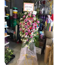 Grand 2452. An arrangement by Flamingo Floral and Gifts.