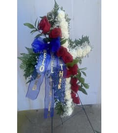 Cross spray with roses. An arrangement by Kelly Ann's Floral.