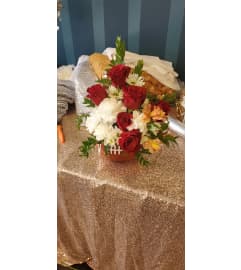 Football Lover. An arrangement by Now and Forever Flower Boutique.