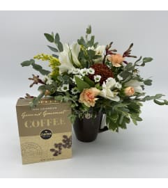 Coffee break floral arrangement. An arrangement by Flower Trends Florists.