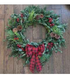 Evergreen. An arrangement by Big Event Floral and Decorating Co..