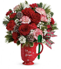 Merry Mug (Teleflora). An arrangement by Sueppel's Flowers. Merry Mug (Teleflora). An arrangement by Sueppel's Flowers.