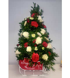 sleigh tree. An arrangement by Delray Beach Flower Market.