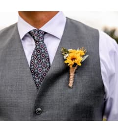 Sunflower Boutonniere. An arrangement by Geni's Florist and Gifts.