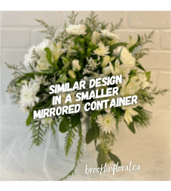 White and Silver Elegance Centrepiece. An arrangement by Brooklin Floral and Garden Shoppe Inc..