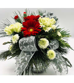 Silver Christmas Joy. An arrangement by The Village Green Florist. Silver Christmas Joy. An arrangement by The Village Green Florist.