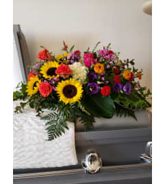 Gathered Garden Style Casket Spray. An arrangement by Flowers By Fiore.