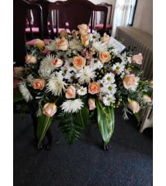 Peaches and Cream Casket Spray. An arrangement by Flowers By Fiore.