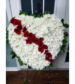Broken Heart with a Rose break. An arrangement by Flowers By Fiore.
