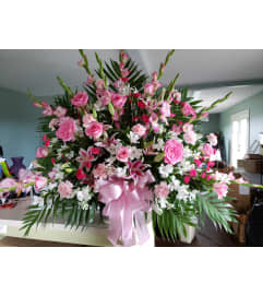 Pretty in Pink Mache. An arrangement by Flowers By Fiore.