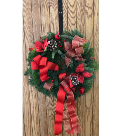 Santa is in the door. An arrangement by Floreria Mexico.