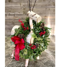 Birch Reindeer with Holiday Wreath. An arrangement by Donato's Floral. Birch Reindeer with Holiday Wreath. An arrangement by Donato's Floral.