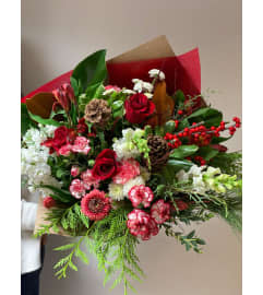 Christmas Bouquet Designer's Choice Red and White. An arrangement by Linda's Floral Designs.