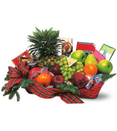 Plentiful Christmas fruit basket. An arrangement by Big Event Floral and Decorating Co..