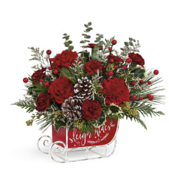 A Vintage Sleigh Ride By Teleflora. An arrangement by North Liberty Flower Shop.
