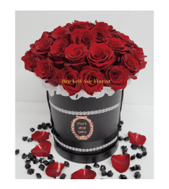 Red Roses in a Black Couture Box. An arrangement by Aventura Blooming Petals.