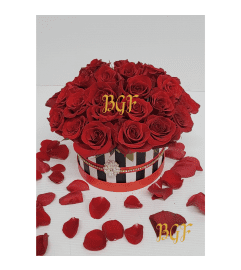 Channel Roses in Striped Couture Box. An arrangement by Brickell Exclusive Blooms.