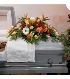Sunrise Sunset Casket Spray. An arrangement by Now and Forever Flower Boutique.