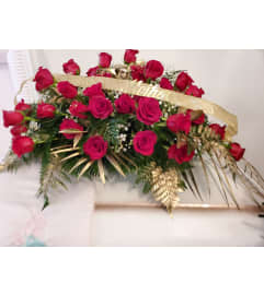 Classic Royal Rose Casket Spray. An arrangement by Now and Forever Flower Boutique.