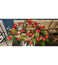 Black and Red Casket Spray. An arrangement by Now and Forever Flower Boutique.