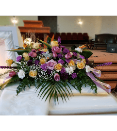 Lavender Hearts Casket Spray. An arrangement by Now and Forever Flower Boutique.
