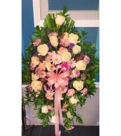 Roses and Daisy Easel Spray. An arrangement by Now and Forever Flower Boutique.