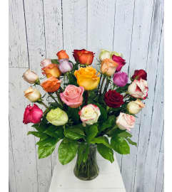 Premium 24 Color Rose Arrangement. An arrangement by Avenida Flowers.