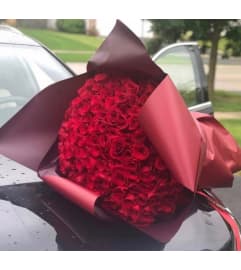 Red Wrapped Roses. An arrangement by Rose Flowers. Red Wrapped Roses. An arrangement by Rose Flowers.