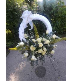 NameMe Wreath 513. An arrangement by Now and Forever Flower Boutique.