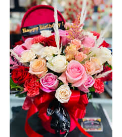 Suede Box roses. An arrangement by Geni's Florist and Gifts.