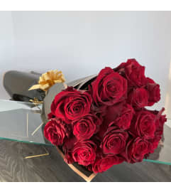 Deep Red Roses Bouquet. An arrangement by Violeta's Flower Shop.