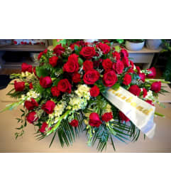 Deeply Adored Casket Spray. An arrangement by Owen Sound Flowers.