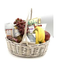 Glorious Gourmet Gift Basket. An arrangement by The Village Green Florist.