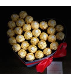 ferrero heart chocolate. An arrangement by Butterflies Flower Shop.