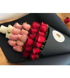 24 roses. An arrangement by Butterflies Flower Shop.