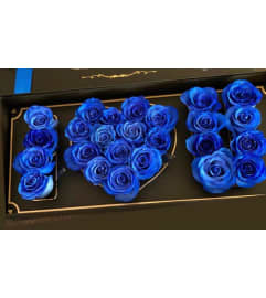 blue sky box. An arrangement by Butterflies Flower Shop.