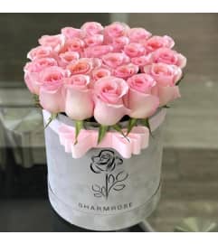 TWENTY FOUR PINK KISSES. An arrangement by Butterflies Flower Shop.