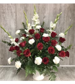 Red and White Tribute Arrangement. An arrangement by Roma Flowers and Gifts.