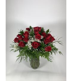24 classic red roses. An arrangement by DMP Flowers and Gifts.