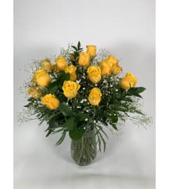 24 yellow roses. An arrangement by DMP Flowers and Gifts.