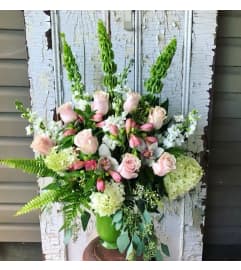 Whispering Blooms. An arrangement by Avenue Florist.