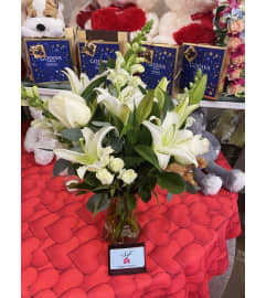 Cherished In White. An arrangement by Sonia's Florist.