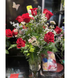 Embellished Dozen Roses Arrangement. An arrangement by Gardenfairy Florist.