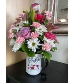 Fiftyish Birthday Mug. An arrangement by Dream Petals Floral.